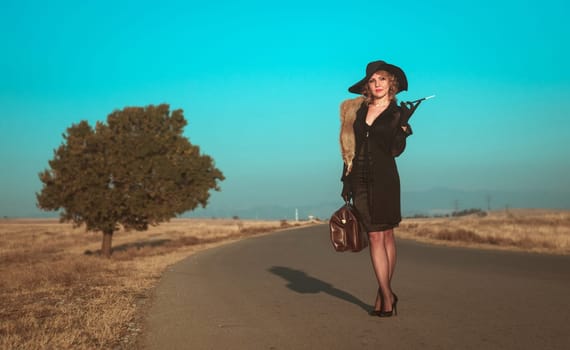 Retro beautiful blond woman portrait on road