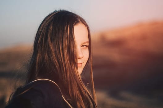 Young girl outdoor portrait in sunlight