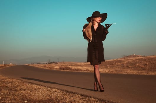 Retro beautiful blond woman portrait on road