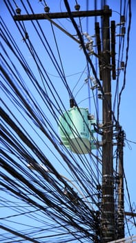 salvador, bahia / brazil - july 1, 2020: electrical network transformer is seen amidst pole wiring in the neighborhood of Pernambues, in the city of Salvador..