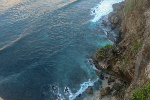 Uluwatu Temple Pura Luhur Uluwatu is a Balinese Hindu sea temple located in Uluwatu. It is renowned for its magnificent location, perched on top of a cliff. Picturesque bright cliff landscape.