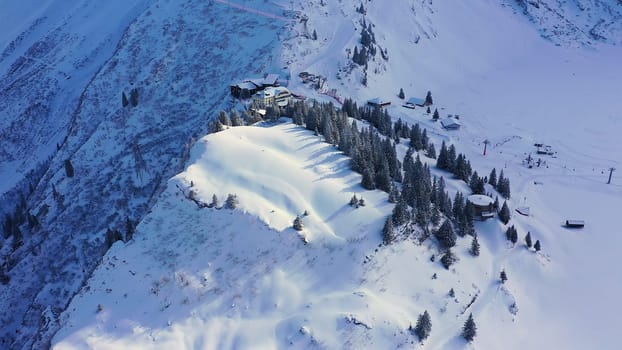 Flight over a snowy mountains in winter - wonderful Swiss Alps - aerial photography