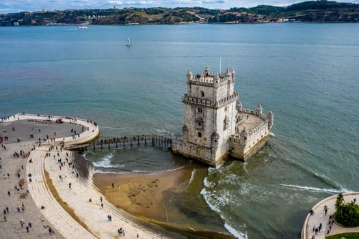 Most important landmark in Lisbon . The Tower of Belem from above - aerial drone footage