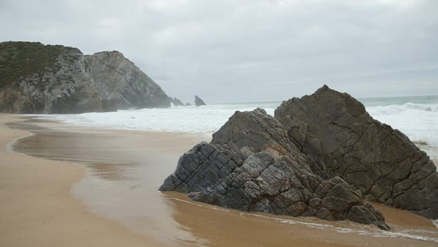 Beautiful Adraga Beach at the Atlantic Ocean coast in Portugal - travel photography