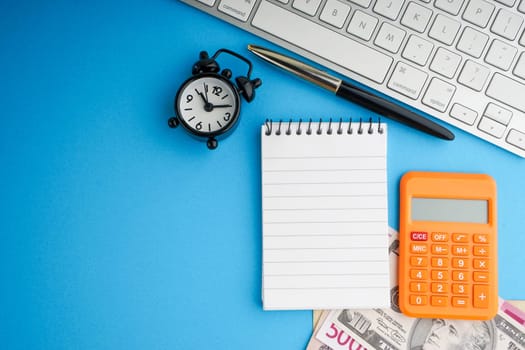 Flat lay of business with office stationary concept on blue background. Business and Copy Space concept