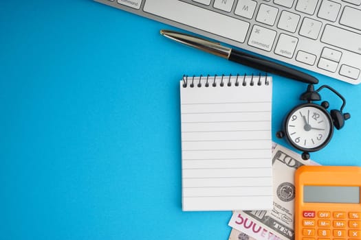 Flat lay of business with office stationary concept on blue background. Business and Copy Space concept