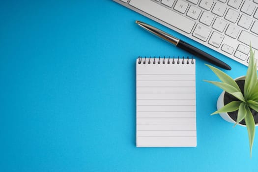 Flat lay of business with office stationary concept on blue background. Business and Copy Space concept
