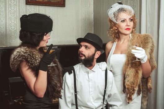 Two retro women and man portrait closeup