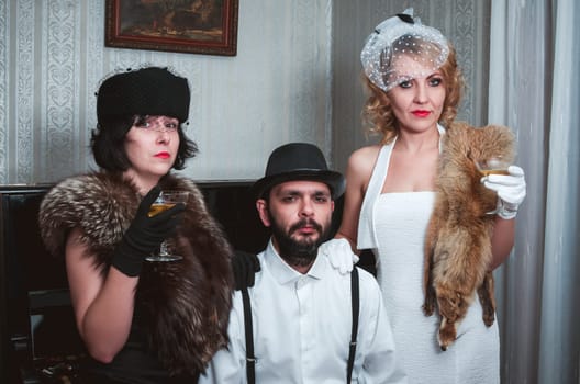 Two retro women and man portrait closeup