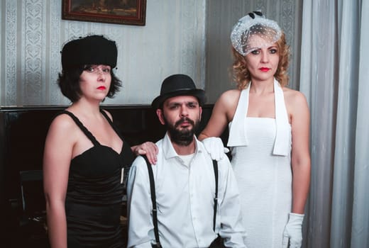 Two retro women and man portrait closeup