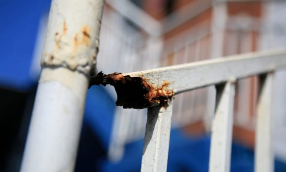 salvador, bahia / brazil - july 1, 2020: rust is seen on a stairway protection grid in the neighborhood of Pernambues in the city of Salvador.