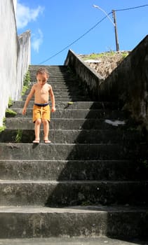 salvador, bahia / brazil - july 2, 2020: child is seen descending stairs in residential condominium in the city of Salvador....