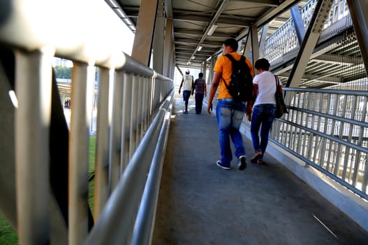 salvador, bahia / brazil - september 23, 2015: people are seen on the access walkway to the bus station next to the metro station in Rotula do Abacaxi in the city of Salvador.