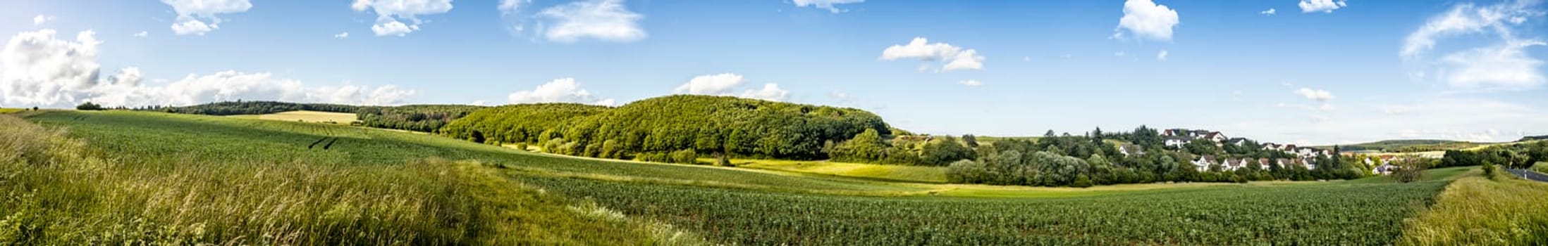 Idyllic panorama from farmland and meadows in hesse germany