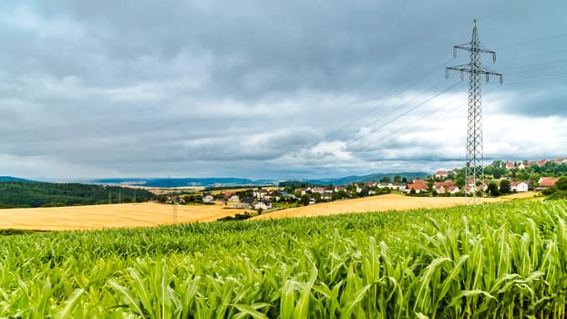 Electrical high voltage pylon in landscape in North Hesse Waldecker Land, Germany