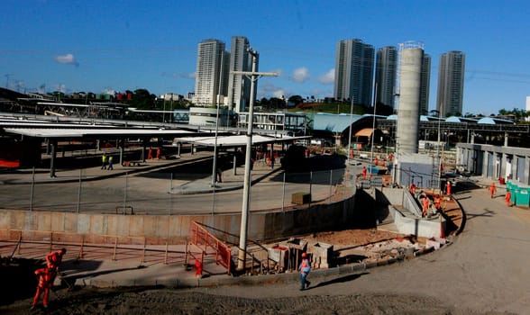 salvador, bahia / brazil - september 15, 2015: workers are seen working on the construction of the bus station next to the metro station in Ratula do Abacaxi in the city of Salvador...