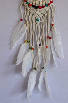 White dreamcatcher - Indian amulet that protects the sleeper from evil spirits and diseases.. The tree - symbol of life. White background.