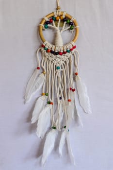 White dreamcatcher - Indian amulet that protects the sleeper from evil spirits and diseases.. The tree - symbol of life. White background.