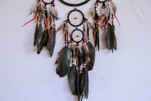 Macro view of real native dream catcher details on pure white background.