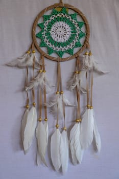 Beautiful green dream catcher on white background.