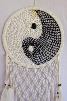 White and black dream catcher Yin Yang. Knitted Indian amulet.
