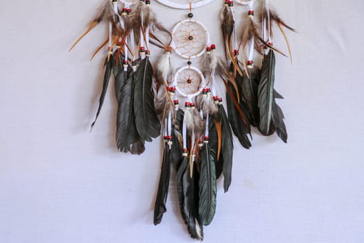 Macro view of real native dream catcher details on pure white background.