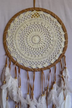 White color dream catcher with white feathers in the interior. Home Decor Concept..