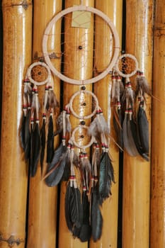 Real native dream catcher on pure natural wooden background.