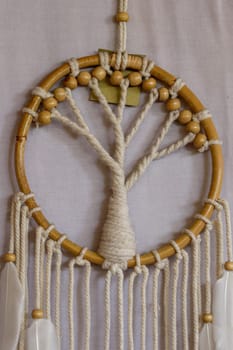 White dreamcatcher - Indian amulet that protects the sleeper from evil spirits and diseases.. The tree - symbol of life. White background.