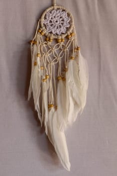 White color dream catcher with white feathers in the interior. Home Decor Concept..