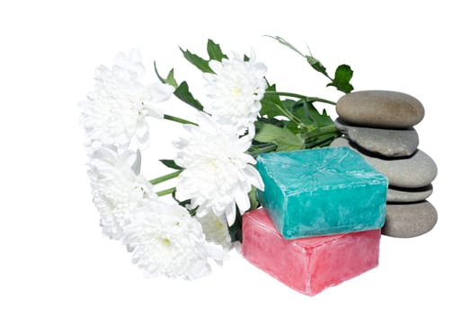 soaps off various shades with grey sone pebbles and flowers
