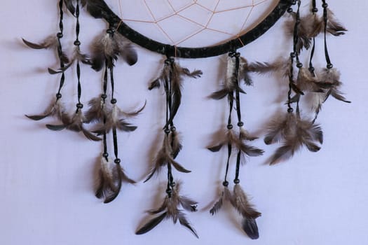 Black dream catcher photo on white background.