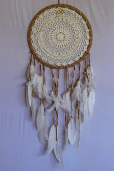White color dream catcher with white feathers in the interior. Home Decor Concept..