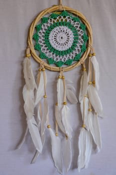 Beautiful green dream catcher on white background.