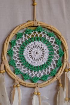 Beautiful green dream catcher on white background.