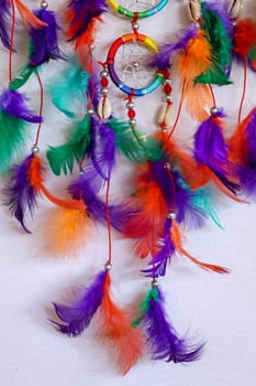 Beautiful multicolored handmade dreamcatcher on white background.