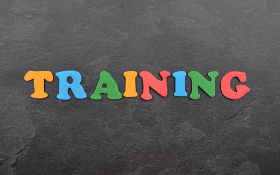 Term from colorful letters on slate board