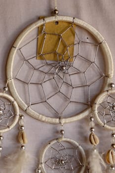 White color dream catcher with white feathers in the interior. Home Decor Concept..