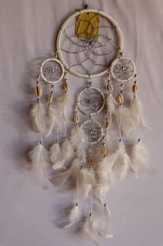 White color dream catcher with white feathers in the interior. Home Decor Concept..