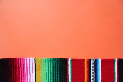 poncho Mexican cinco de mayo rug serape fiesta traditional Mexico background with stripes copy space maya blanket minimal simple -  stock, photo, photograph, image, picture