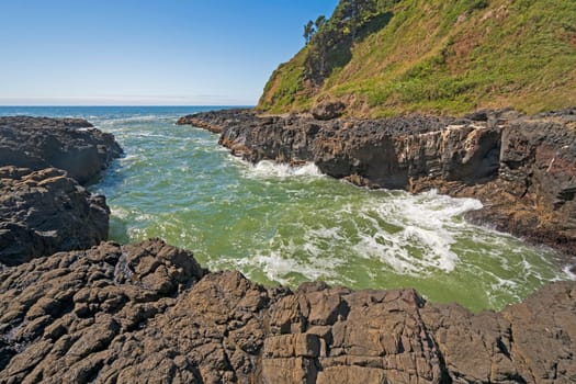 Churning Waters in a Narrow Ocean Inlet at the Devils Churn on Cape Perpetua on the Oregon Coast
