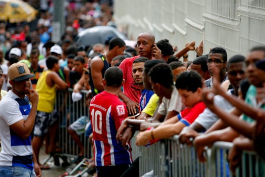salvador, bahia / brazil - april 20, 2015: Esporte Clube Bahia fans face the queue to buy tickets at the Fonte Nova Arena in the city of Salvador, for the Bahia Football Championship match.