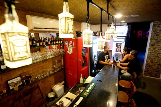 salvador, bahia / brazil - march 2, 2017: people are seen at a bar counter in the city of salvador