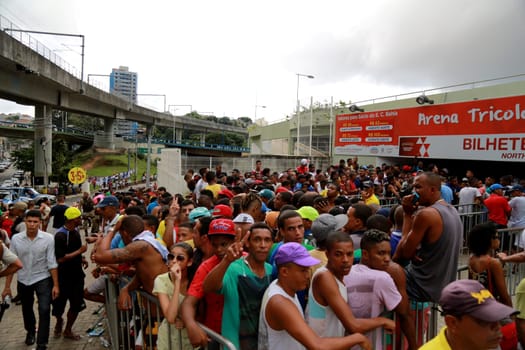 salvador, bahia / brazil - april 20, 2015: Esporte Clube Bahia fans face the queue to buy tickets at the Fonte Nova Arena in the city of Salvador, for the Bahia Football Championship match.