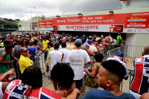 salvador, bahia / brazil - april 20, 2015: Esporte Clube Bahia fans face the queue to buy tickets at the Fonte Nova Arena in the city of Salvador, for the Bahia Football Championship match.