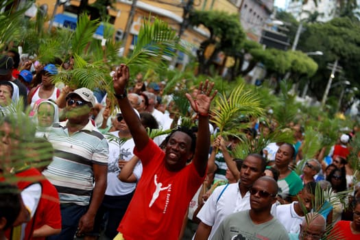 salvador, bahia / brazil - march 29, 2015: Catholics are seen carrying palm branches during Ramos procession in the city of Salvador. The Christian feast, celebrated on the Sunday before Easter, symbolizes the entry of Jesus Christ into Jerusalem..