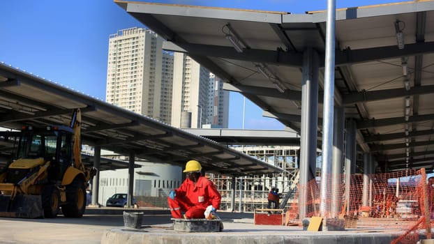 salvador, bahia / brazil - september 15, 2015: workers are seen working on the construction of the bus station next to the metro station in Ratula do Abacaxi in the city of Salvador...