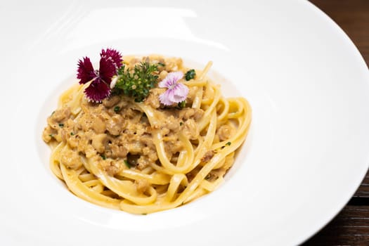 Spaghetti Carbonara pasta meat sauce with cream parmesan cheese, gourmet italian and mesiterranean cuisine recipe for food and drink industry concept.