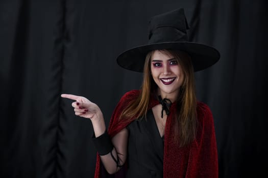 Portrait of asian young adult teenage woman wear Halloween costume cloth for Halloween party carnival. Halloween celebrate and international holiday concept.