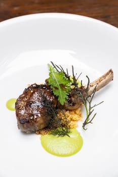 Grilled lamb chop with pesto sauce, international gourmet cuisine a la carte in buffet live station. Using for food and drink industry.